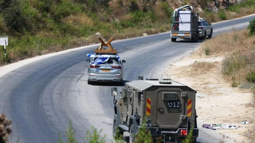 Israelis return to closed West Bank settlement, defying growing international anger